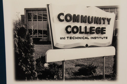 Sign in front of a 60s-style building reading, Community College and Technical Institute.