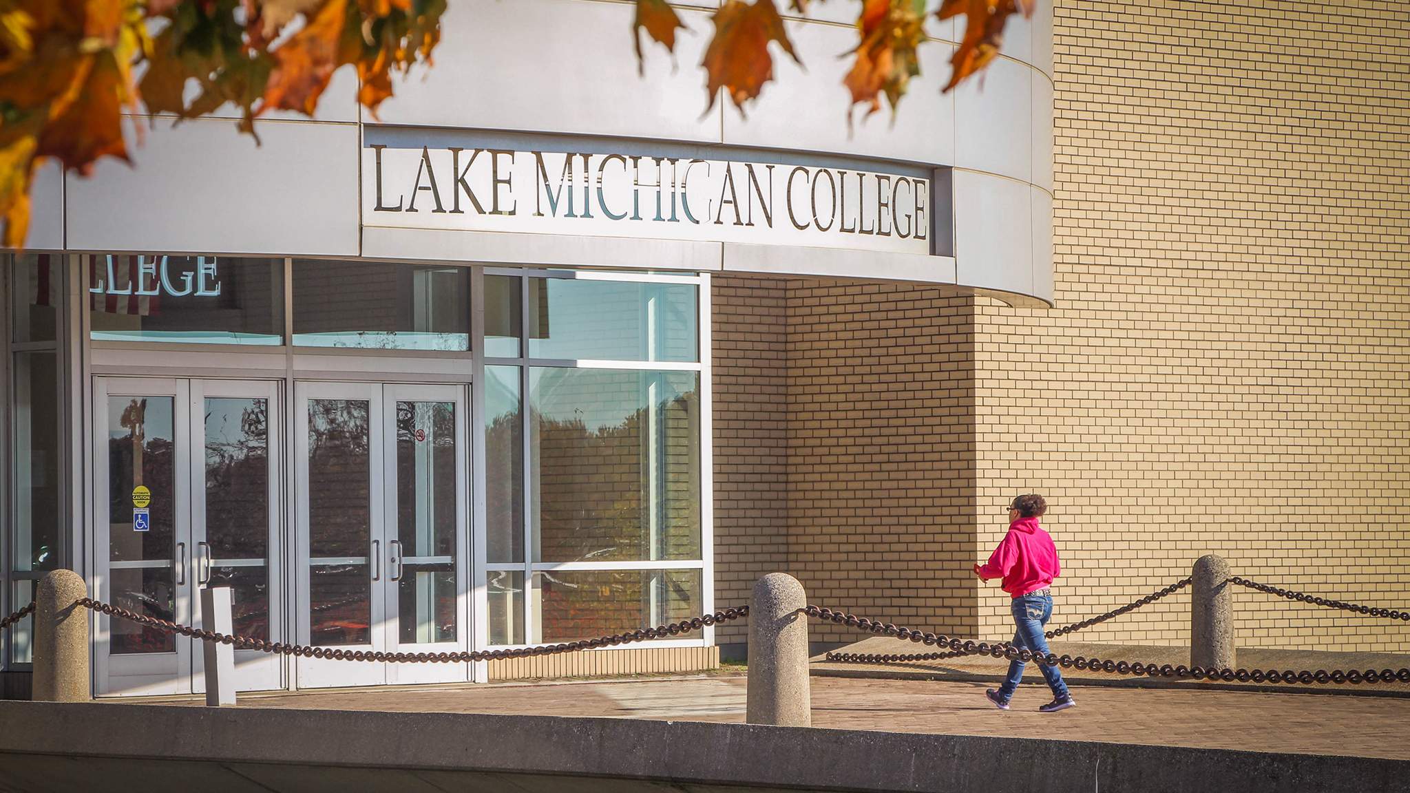 Student walking into LMC Benton Harbor Campus Building