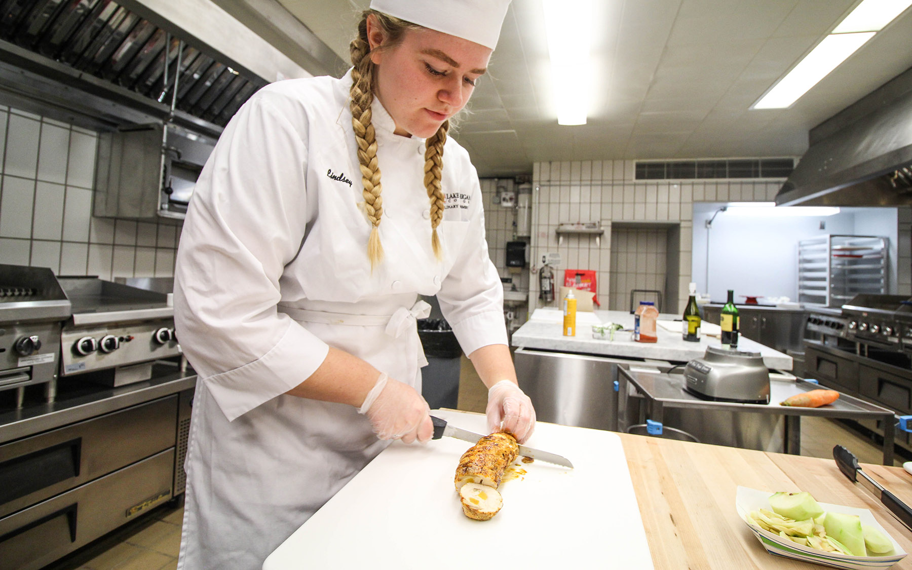 Student cooking in the teaching kitchen