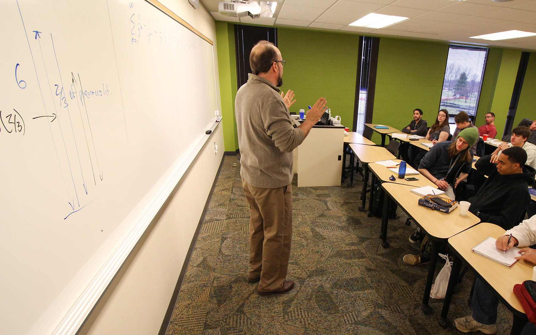 Instructor teaching a math class.