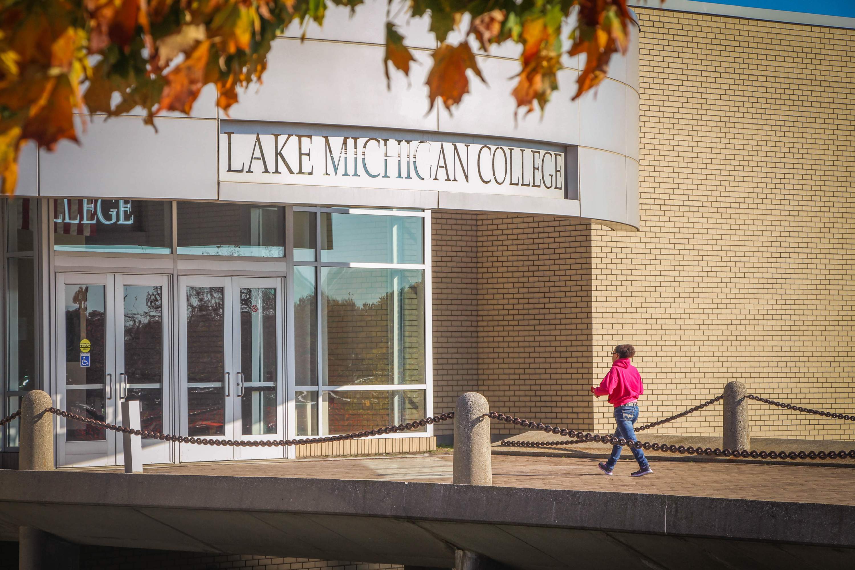 Student Walking into LMC Benton Harbor Building