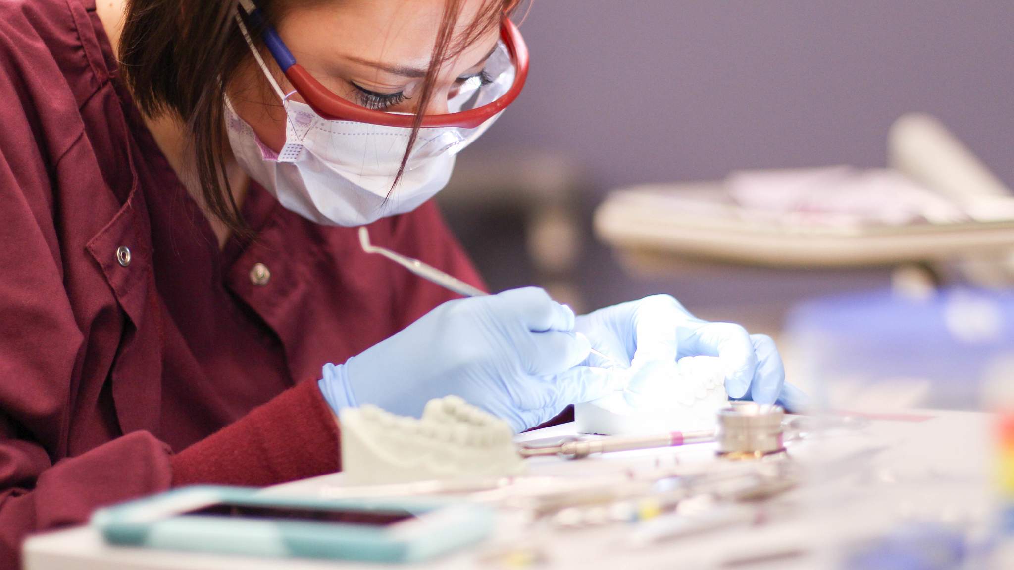 Dental Assistant cleaning a patient's teeth