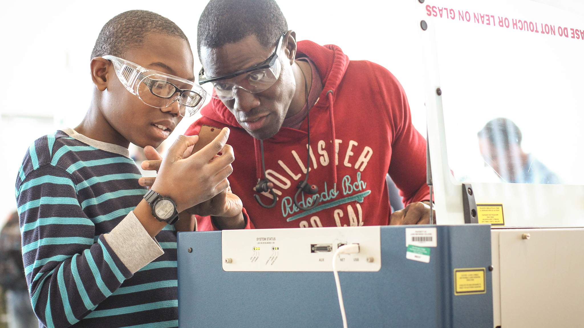 Father and son working together in LMC Fab Lab