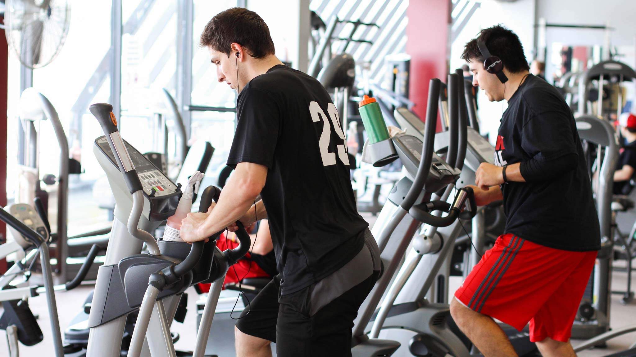 Students working out on a Stairmaster in Wellness Center