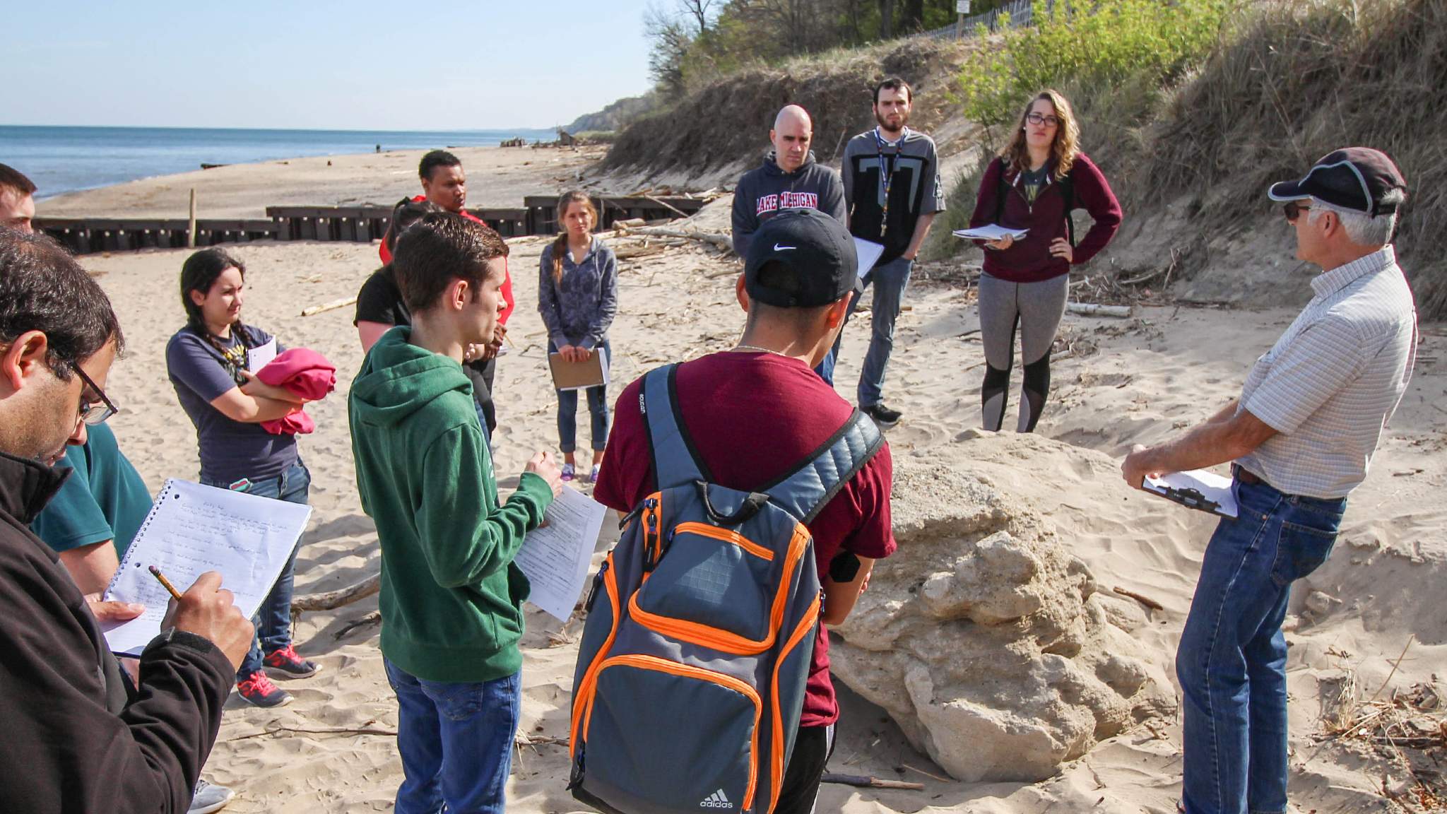 Students at beach with instructor