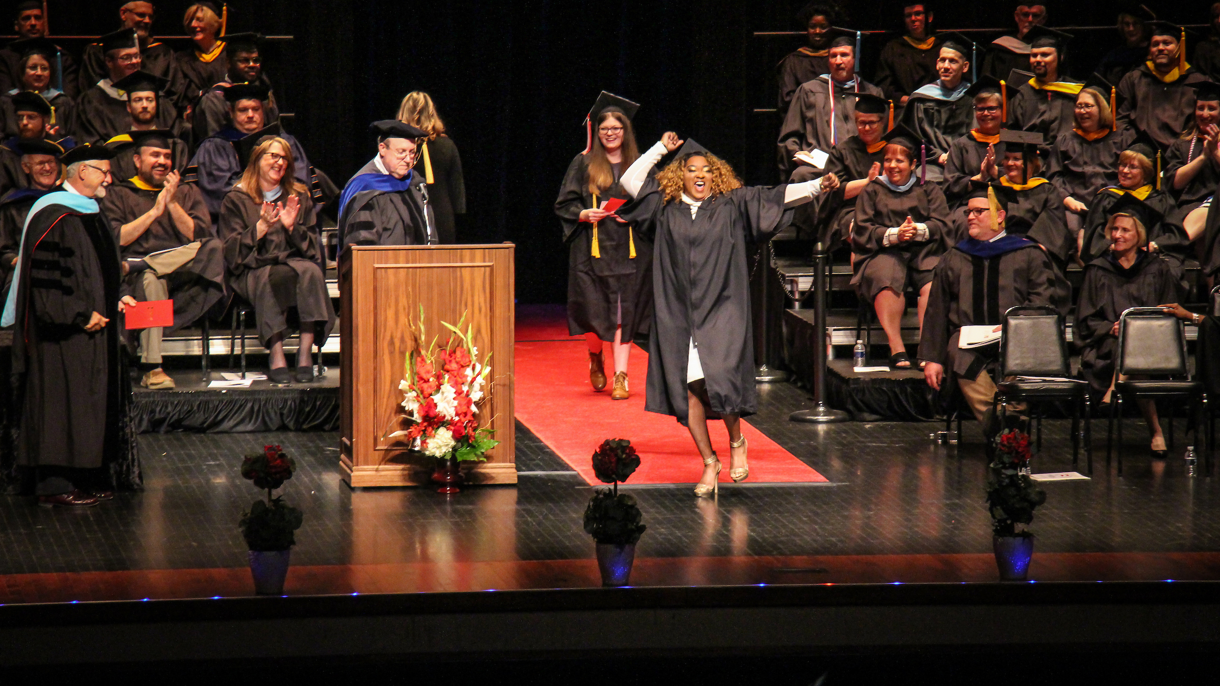 Graduate celebrating at commencement