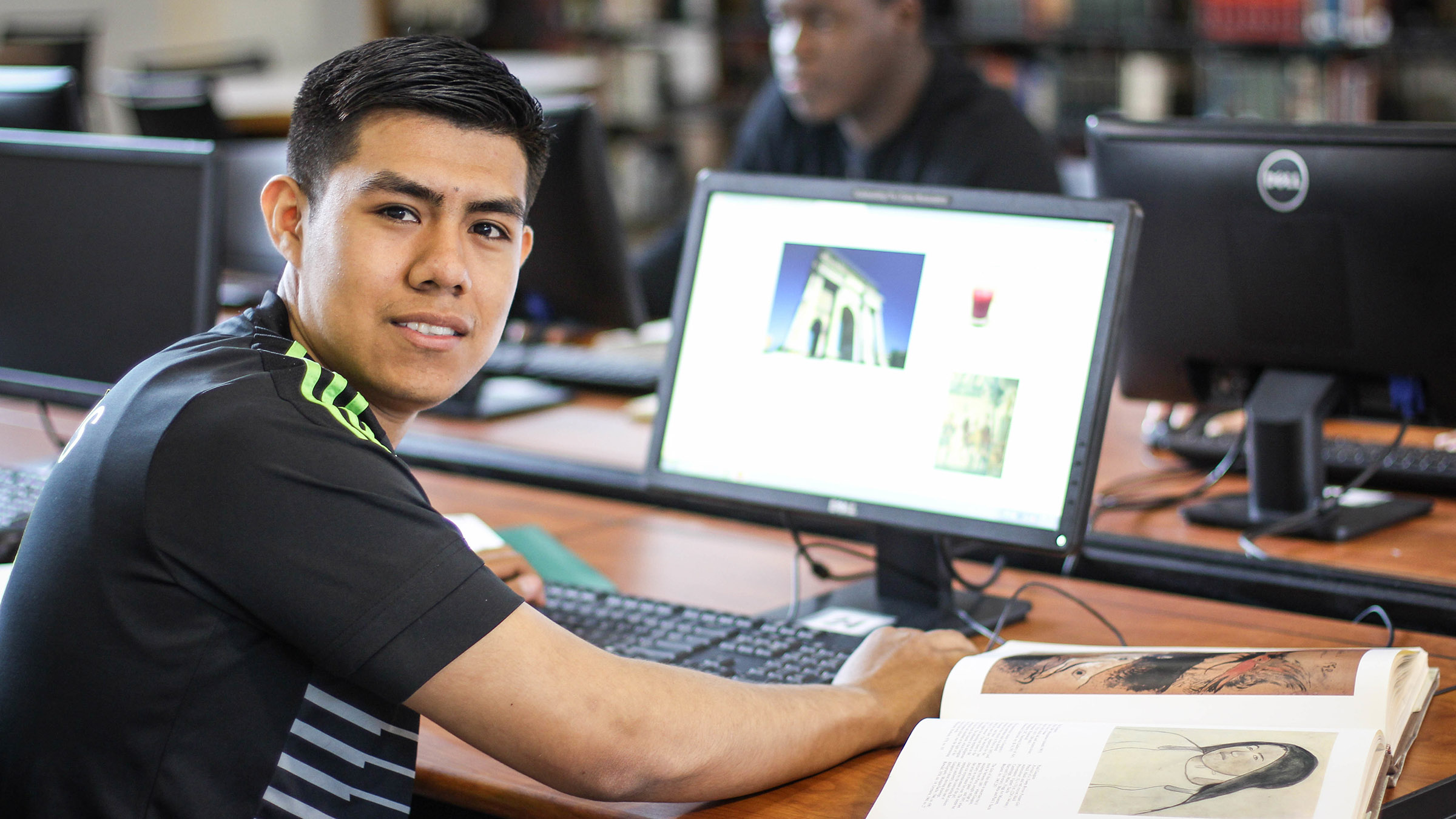 Student using computer lab in the library