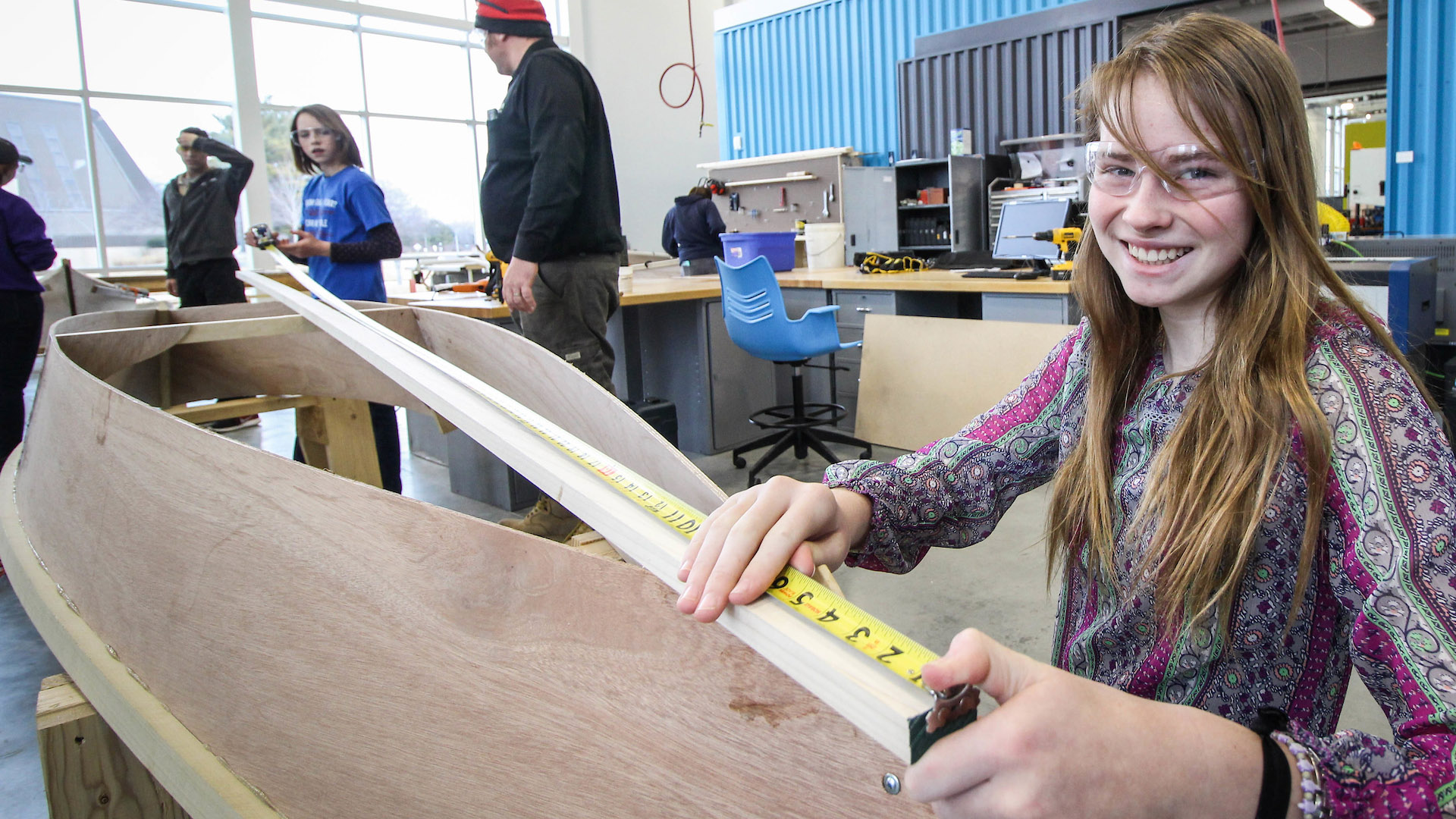 Student building a boat in the Fab Lab