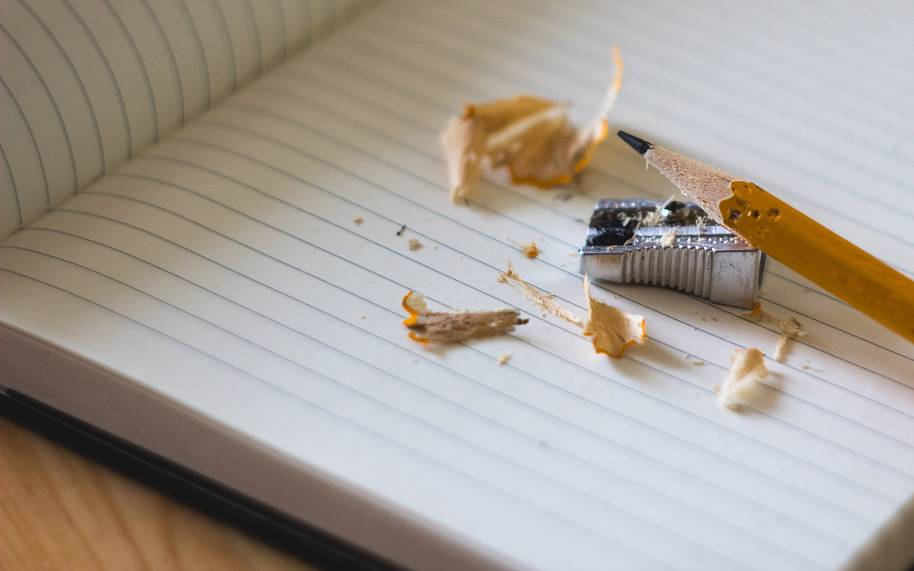 Pencil and sharpener on a blank journal