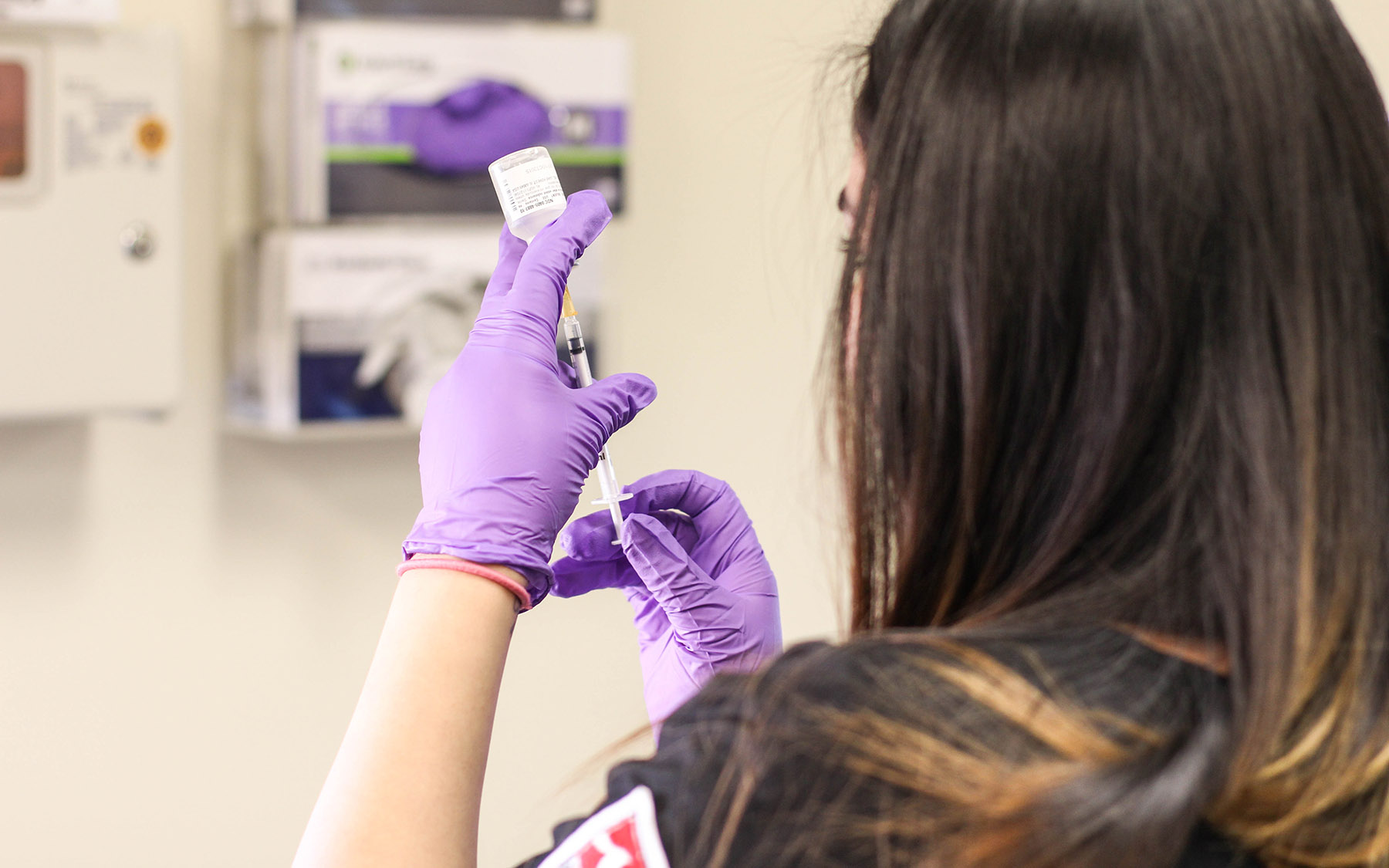 Student preparing a needle