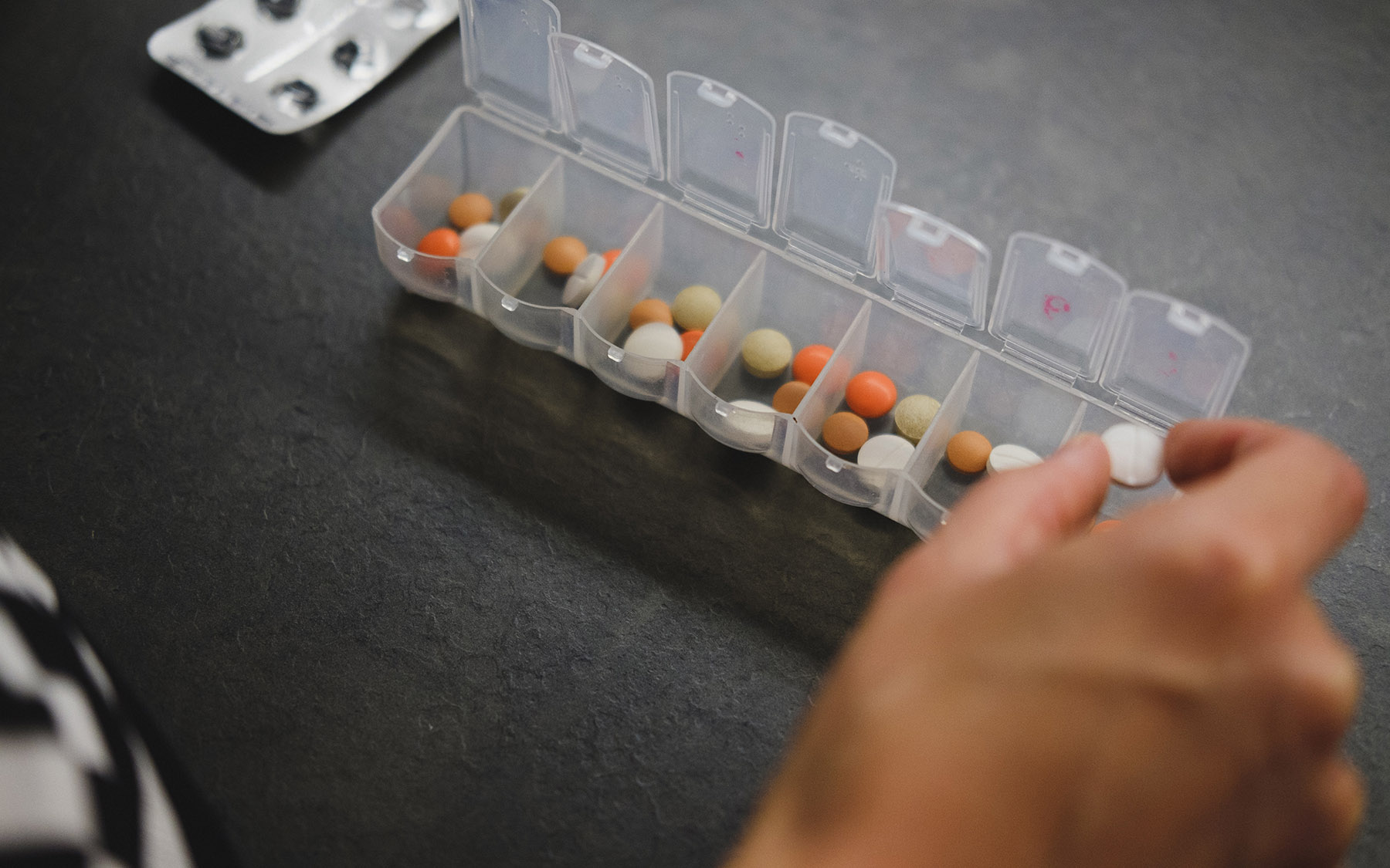 Person sorting pills