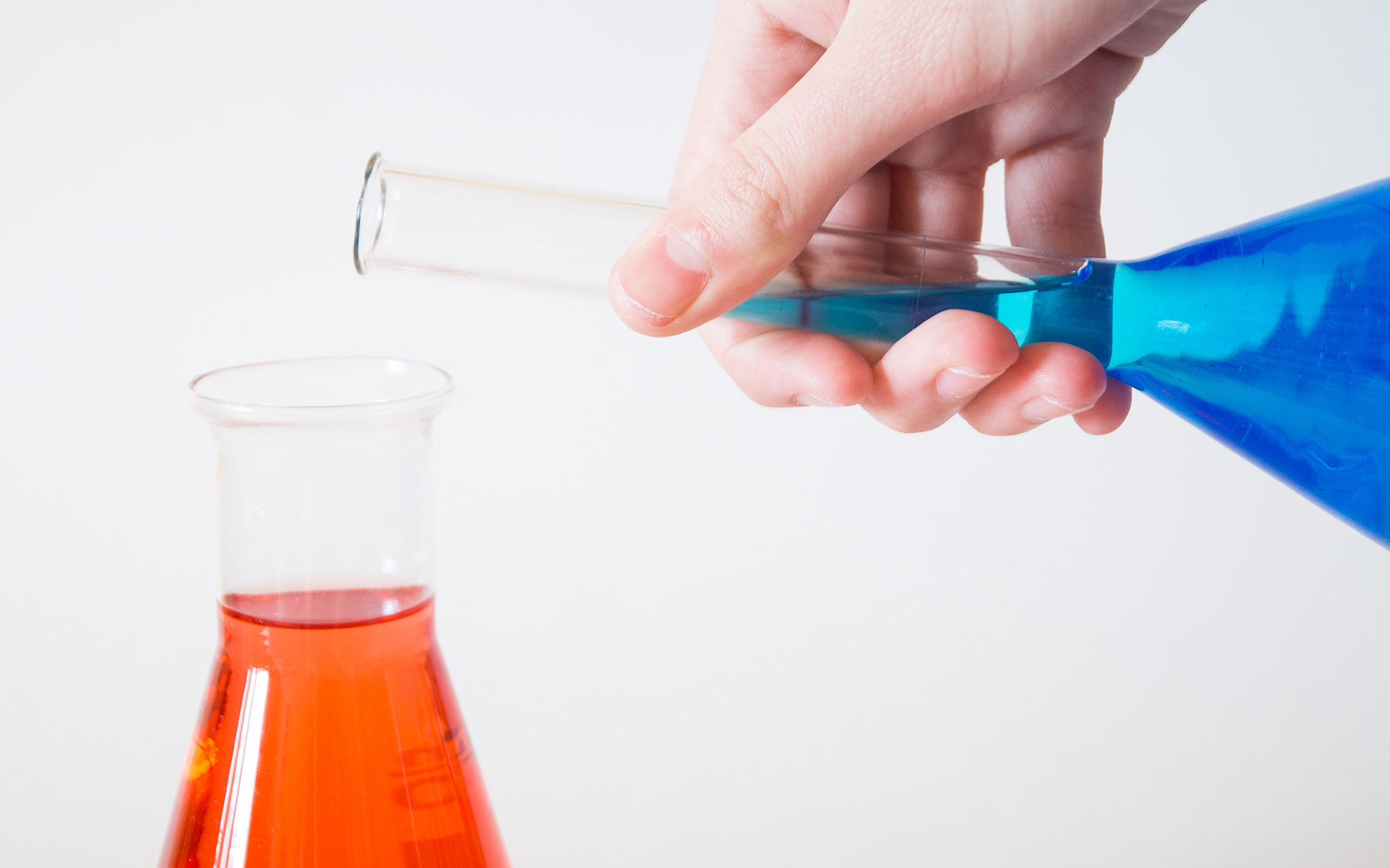 Pouring liquid from one beaker to another