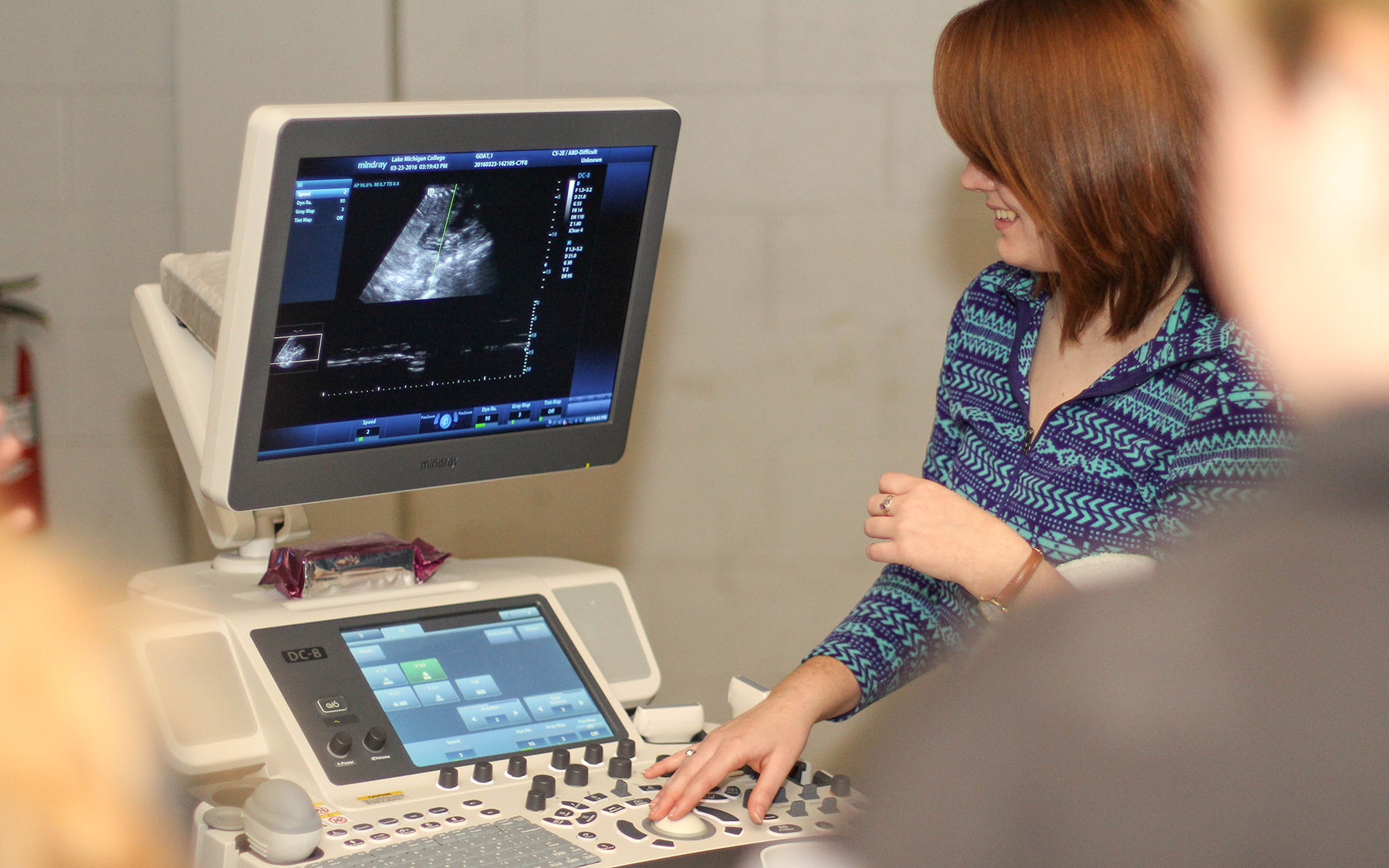 Sonography student looking at an image