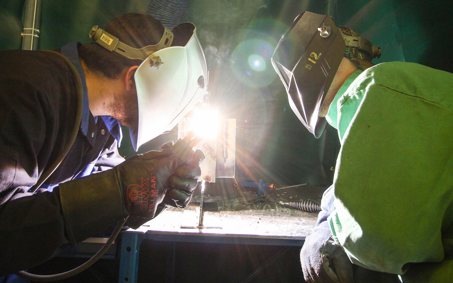 Two students welding