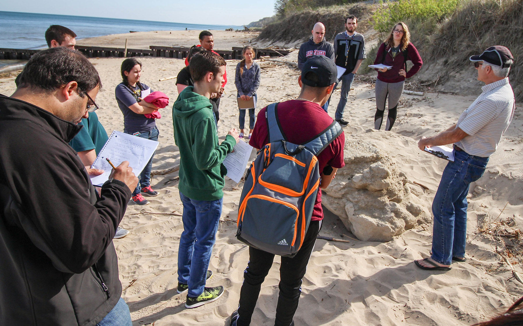 Students at beach with instructor.