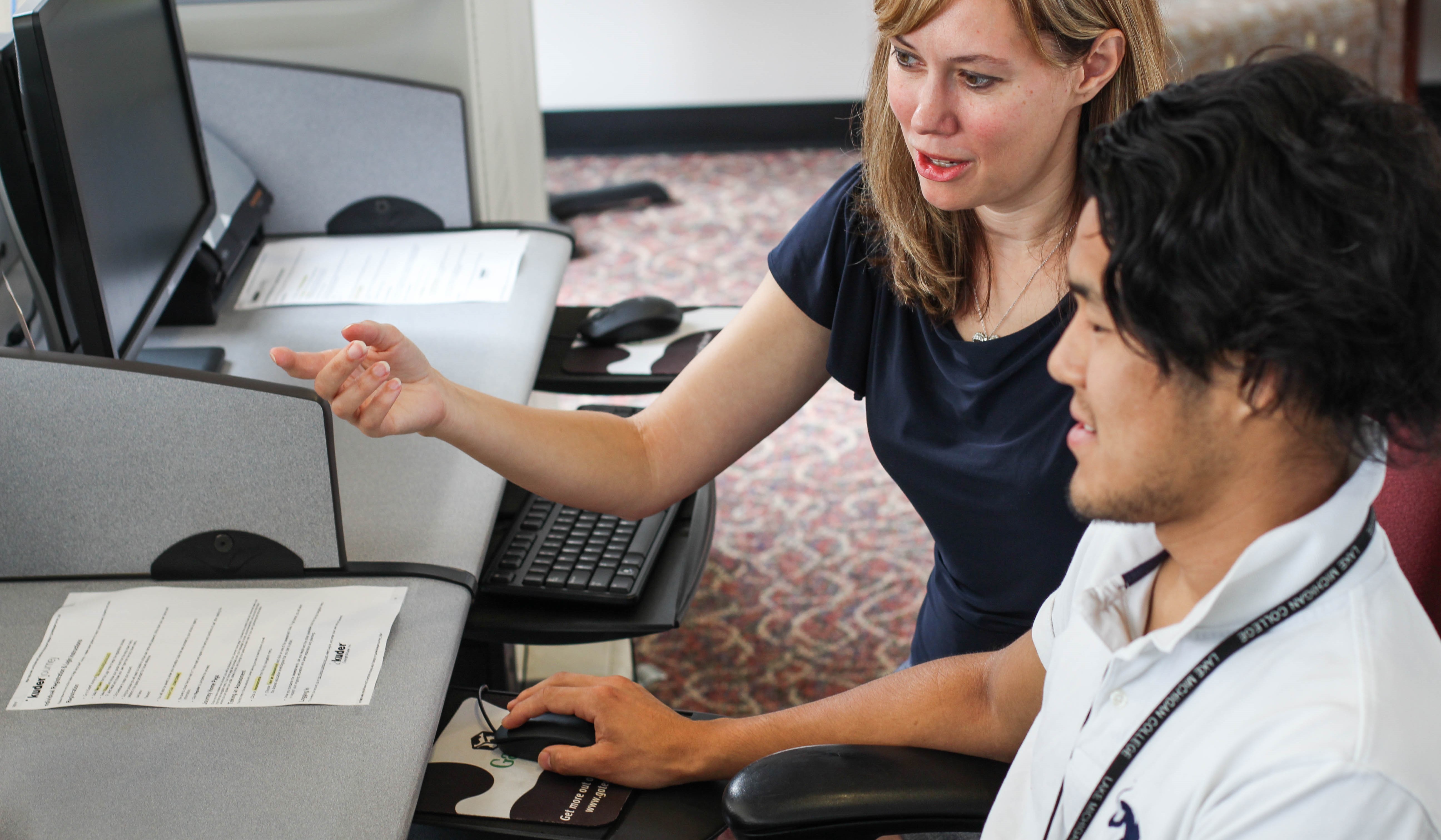 employer with student at computer