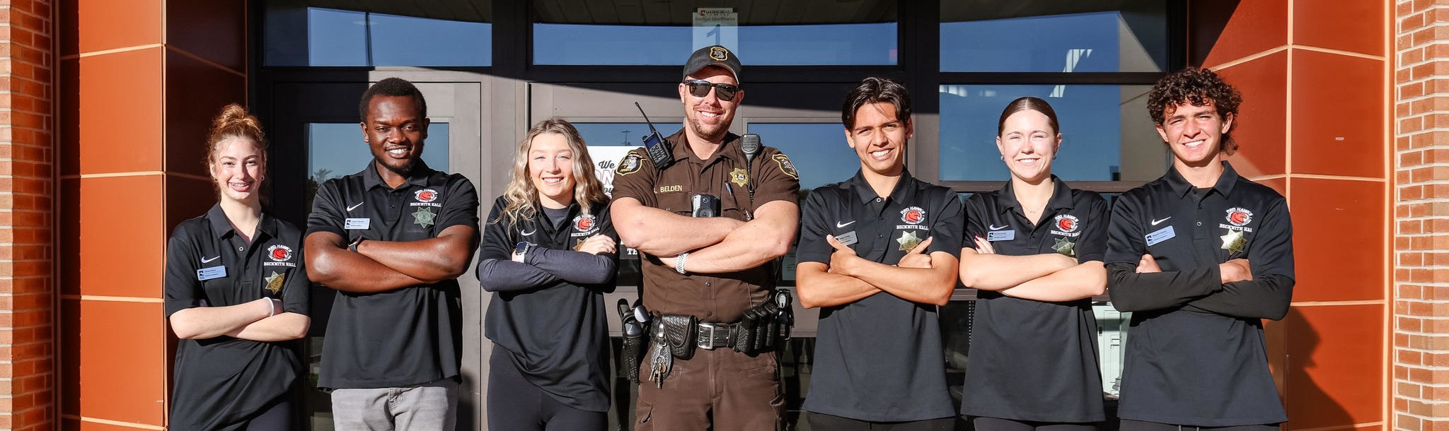 Proud campus police and supporters standing in front of Beckwith Hall