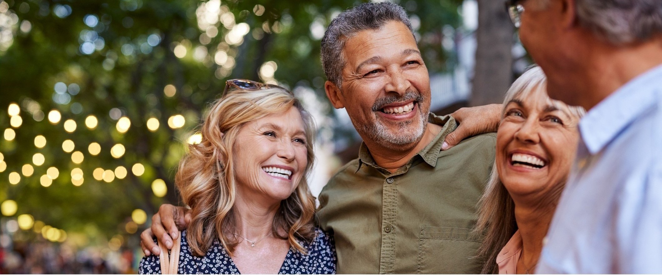 Mature men and women laughing together