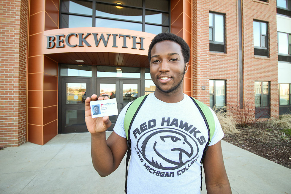 Resident showing camera his new LMC student ID.