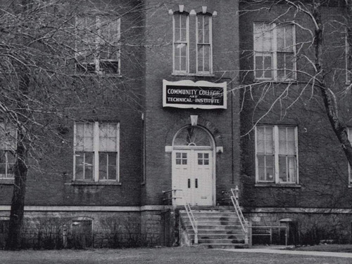 Brick building with a sign that reads Community College and Technical Institute.