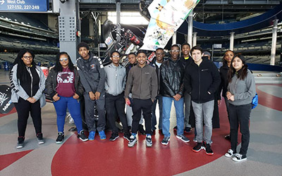 Upward Bound students posing for a group photo on a field trip.
