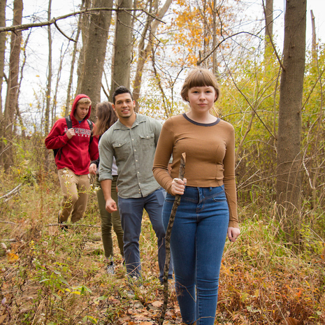 Students walking on the nature trail in autumn.