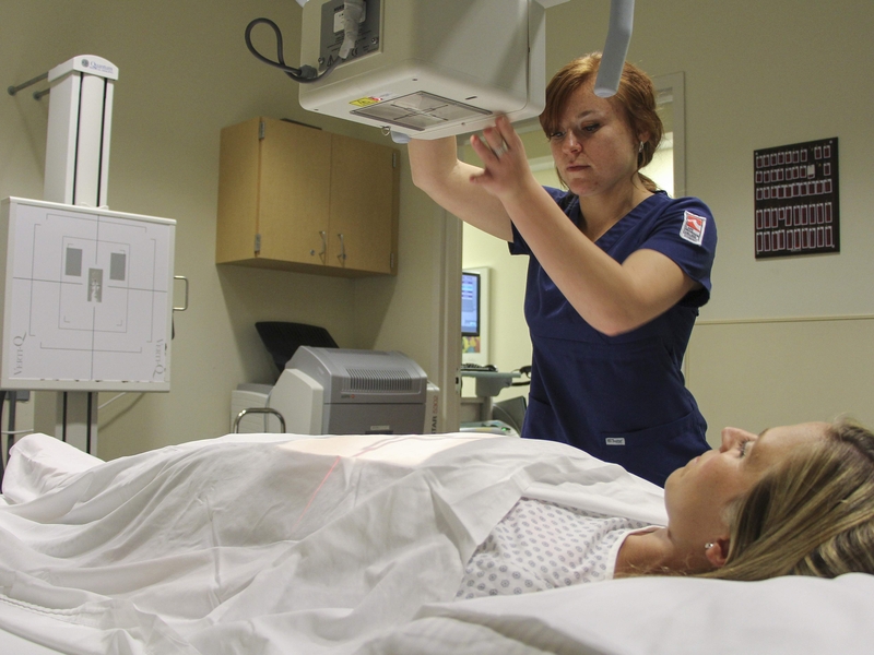 Rad tech student practicing in x-ray lab