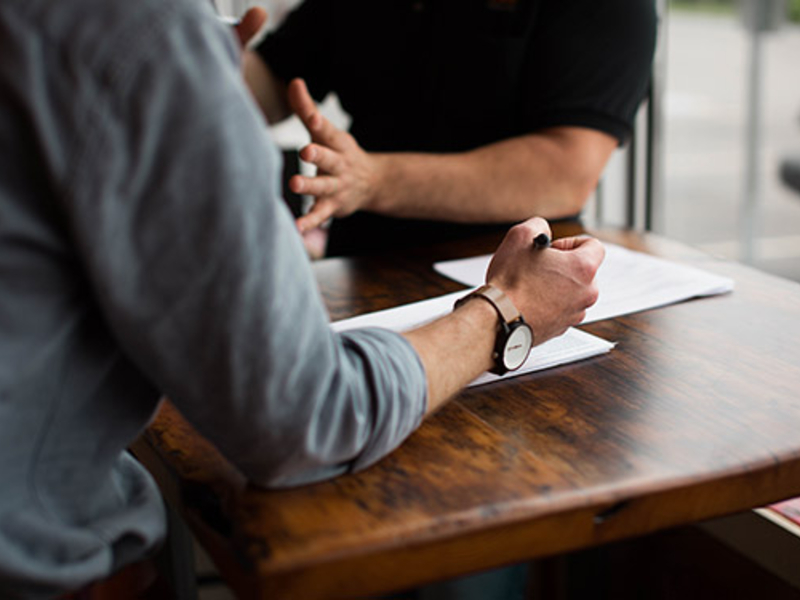 People working at a conference table