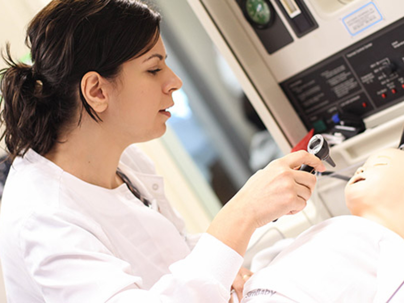 Nursing student working on a mannequin