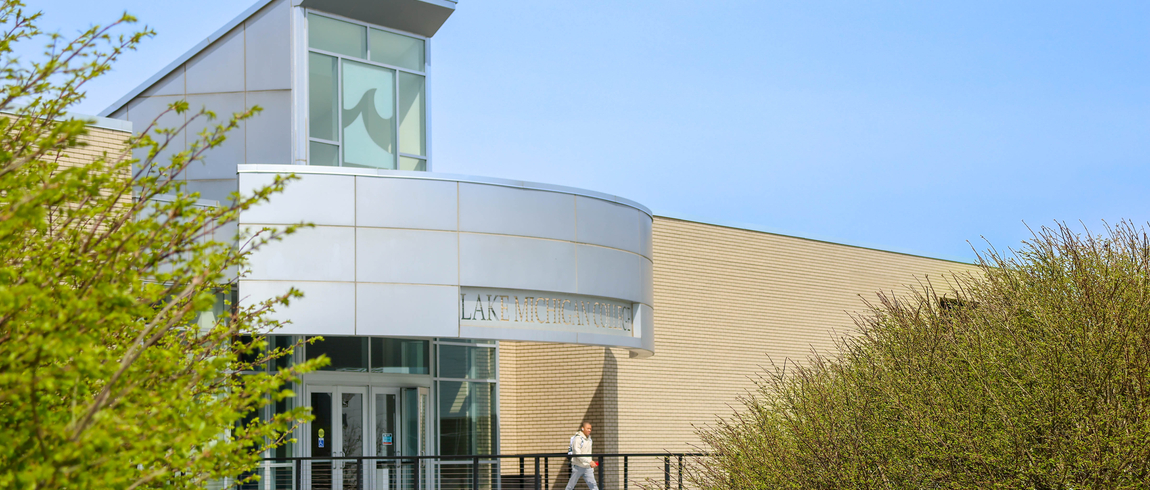A Lake Michigan College student exiting a campus building.