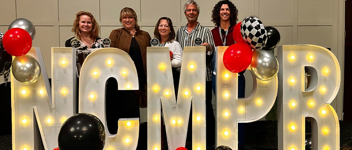 Lake Michigan College Marketing and Communications team members Jennifer Shoemaker, Laura Kraklau, Tina Gourlay, Michael Johnson, and Ian Kauffman display awards at the 2025 NCMPR. 