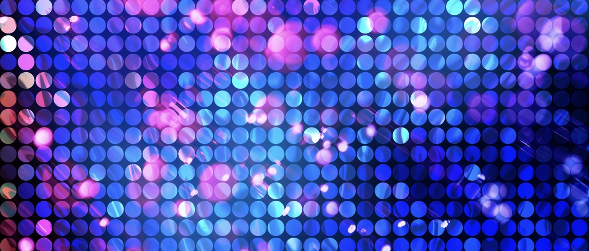 Abstract background of evenly spaced circular dots in a grid pattern, glowing in shades of blue, purple, and pink, with soft light flares and blurred highlights creating a vibrant, futuristic feel.