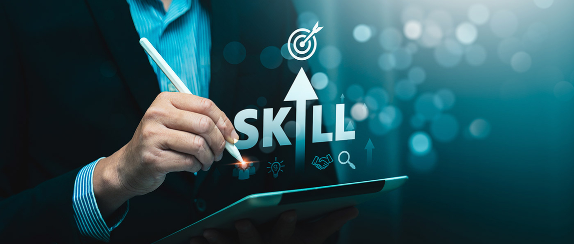 A person in a suit holds a tablet and pen. The word "skill" is stylized so that in place of the letter "i" is an arrow pointing upwards. 
