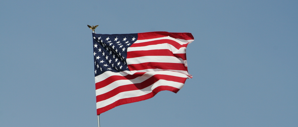 American flag, blue sky
