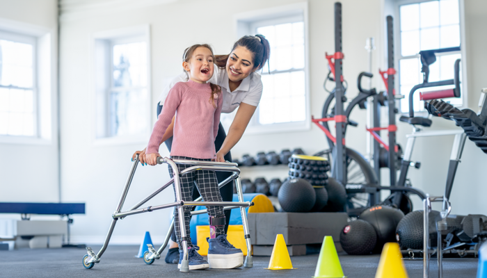 Physical Therapist Assistant with a small child
