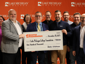 Representatives from Lake Michigan College and 1st Source Bank display a check from 1st Source Foundation to Lake Michigan College Foundation for $100,000.