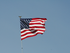 American flag, blue sky