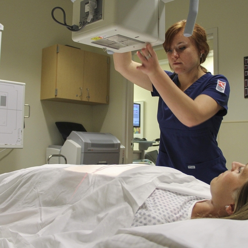 Rad tech student practicing in x-ray lab