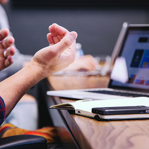 People in a discussion at a conference table