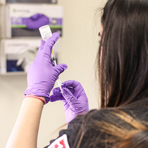 Student preparing a needle