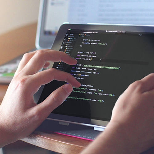 Student working with code on a tablet.